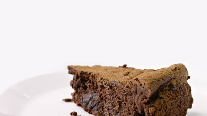 a picutre of a slice of chocolate cake on a white plate
