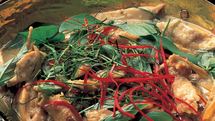 a picture of cooked thai green chicken curry in a pan