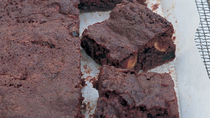 a picture of sliced brownies on a layer of greaseproof paper