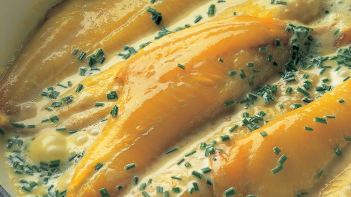 a picture of cooked haddock fillets in a white oven dish