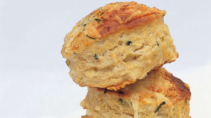 a picture of three stacked buttermilk scones on a white napkin