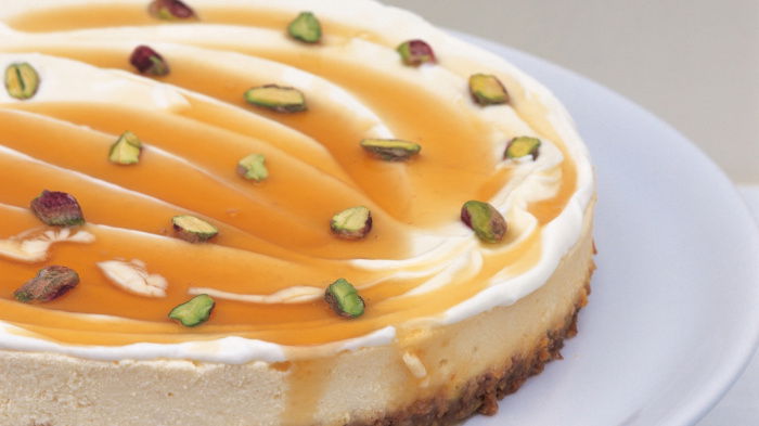 cheesecake with pistachios on a white dish