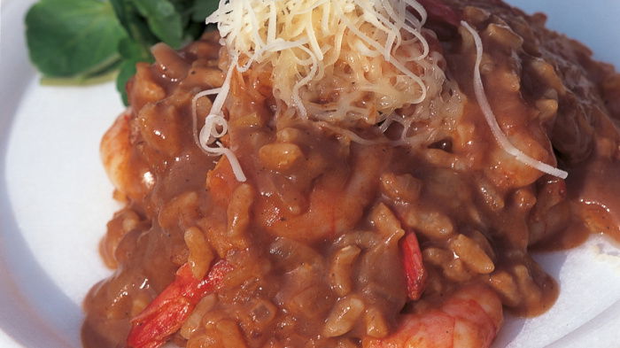 a picture of lobster risotto on a white plate