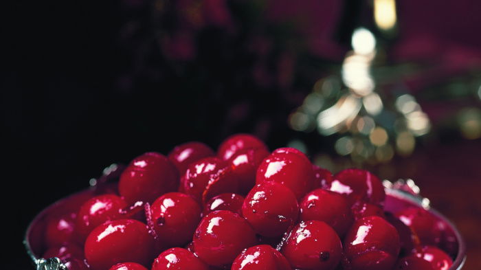 a picture of cranberries in a little silver bowl