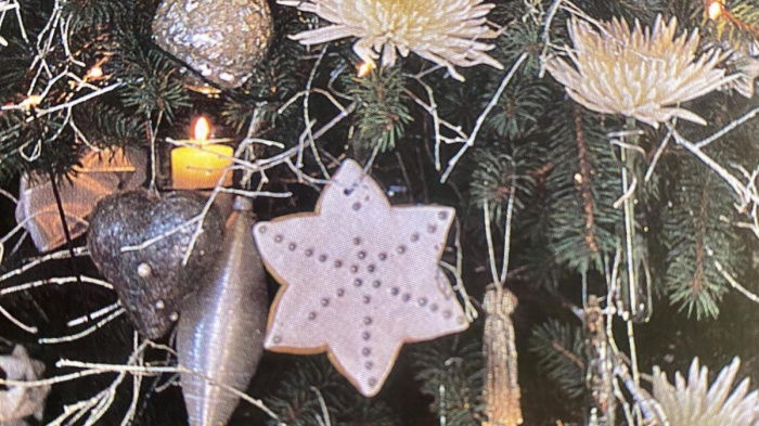 a picture of a christmas tree full of decorations and candles