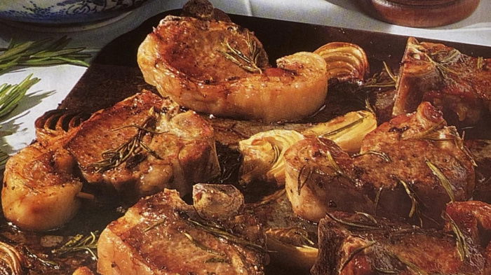 a picture of oven baked lamb chops on a baking tray