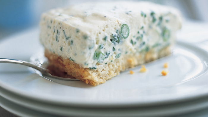 a picture of a slice of feta cheesecake on a white plate