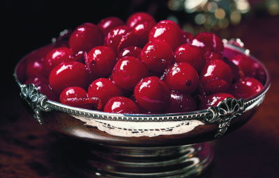 a picture of cranberries in a little silver bowl
