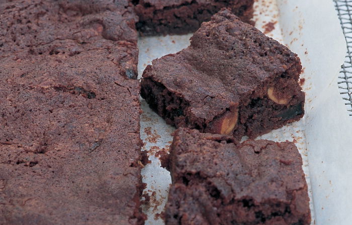 a picture of sliced brownies on a layer of greaseproof paper