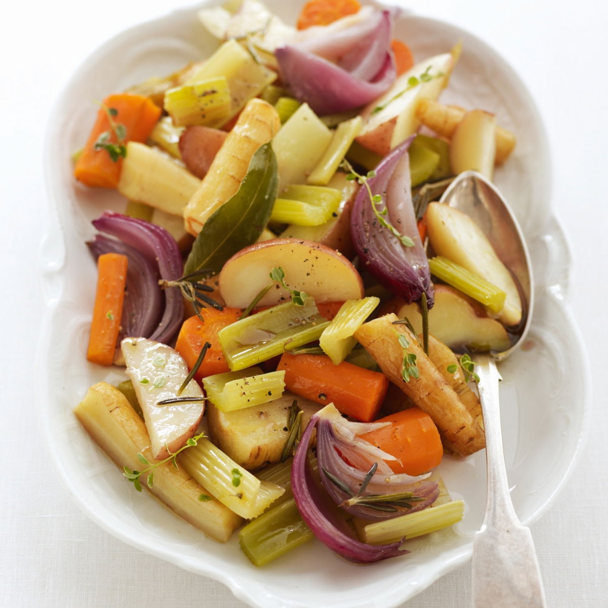 picture of Delia Smith recipe for baked vegetables in serving dish with serving spoon