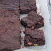 a picture of sliced brownies on a layer of greaseproof paper