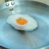 picture of a frying pan with a poached egg