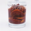 a picture of sliced oranges cinnamon sticks and cloves in a glass jar with port