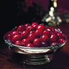 a picture of cranberries in a little silver bowl