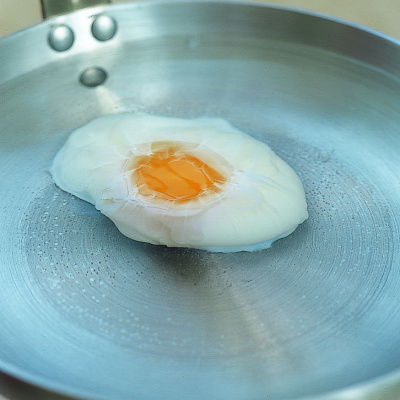 picture of a frying pan with a poached egg