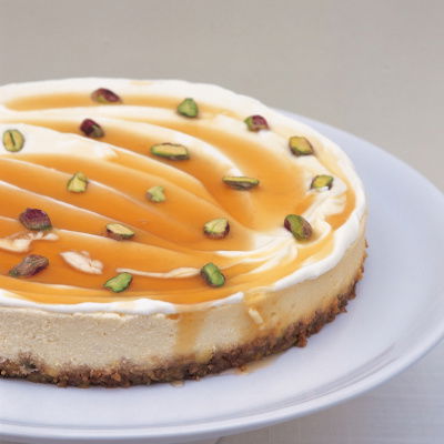 cheesecake with pistachios on a white dish