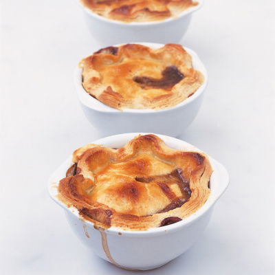 a picutre of three white bowls serving Delia Smith's recipe for individual steak mushroom and kidney pies