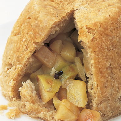cooked suet pudding showing the apple filling