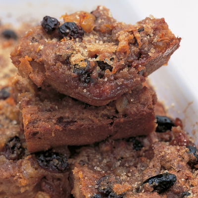 slices of cooked bread and butter pudding in a white bowl