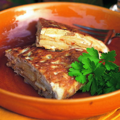 picture of a bowl with slices of tortilla and a garnish
