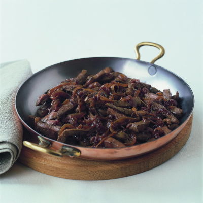a picture of cooked sliced liver in a metal ovenproof dish