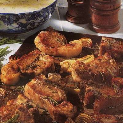 a picture of oven baked lamb chops on a baking tray