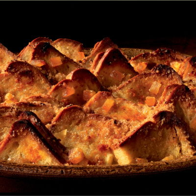 Cooked marmalade bread and butter pudding in a brown dish